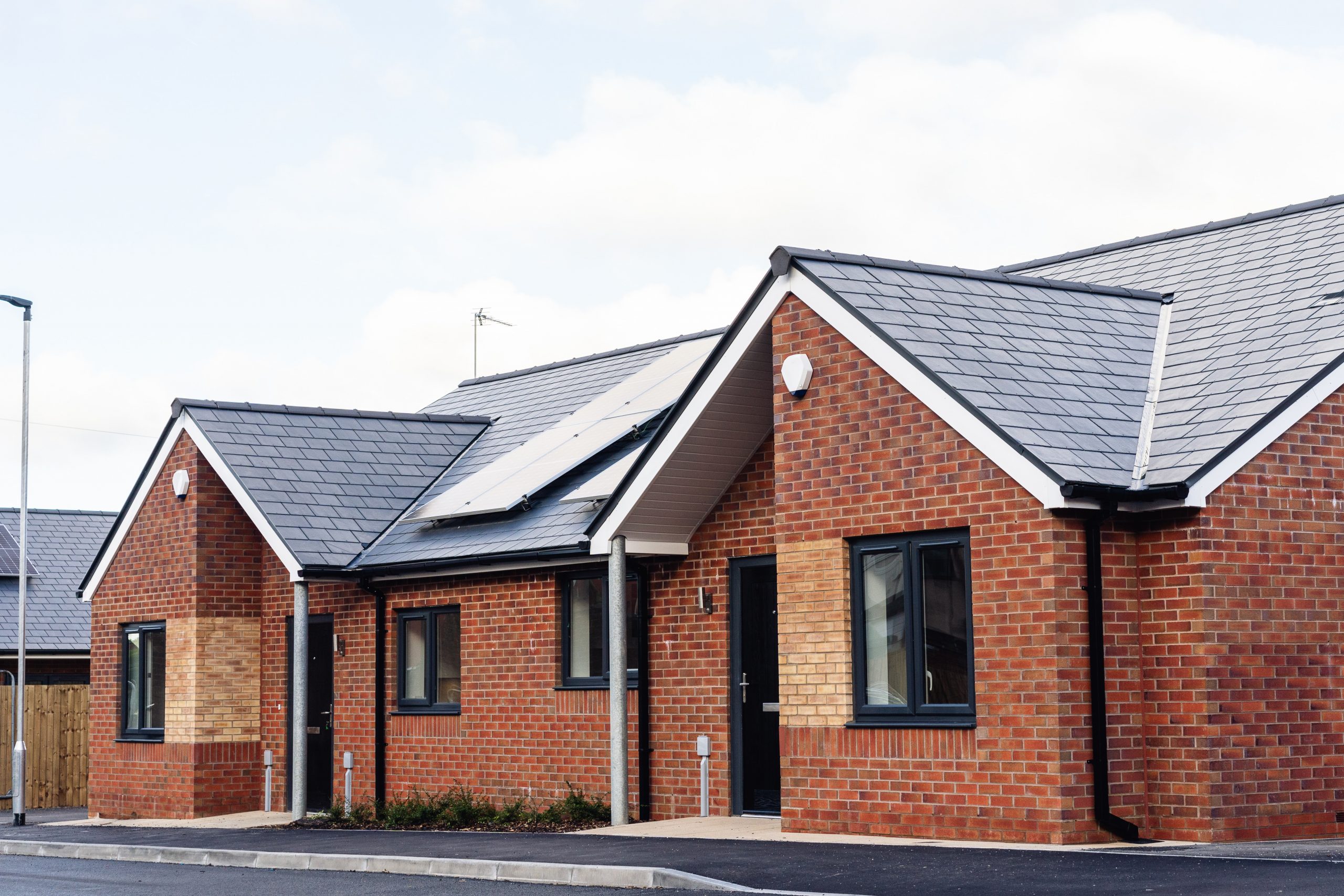 Two of the bungalows at our Lever Gardens Court development in Little Lever, Bolton. There are solar panels on the roof.