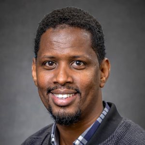 Portrait image of Abdul Ali, our Peer Navigator for Deane.