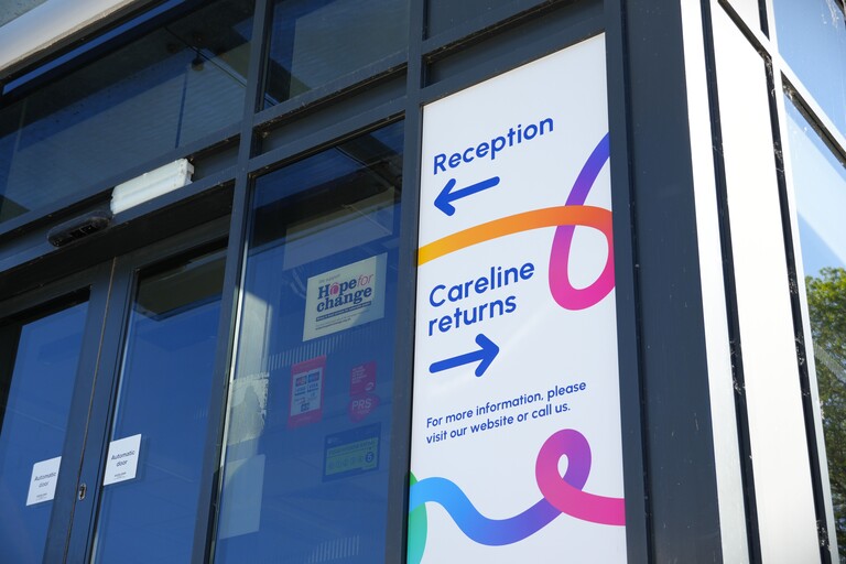 A close-up shot of the signage outside our new Careline control room based at our main Valley House office.