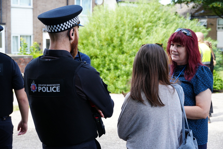 A Be One Homes colleague talking to a Police officer at one of our High-Rise Action Days in 2026.