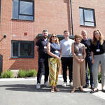 Colleagues from Be One Homes stand outside a newly completed shared ownership home at Rivington Chase.